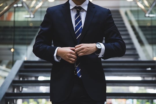 business-man-suit-standing-inside