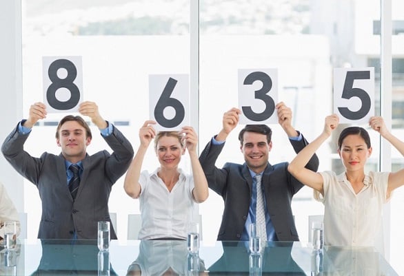 group-panel-judges-holding-score-signs-inside